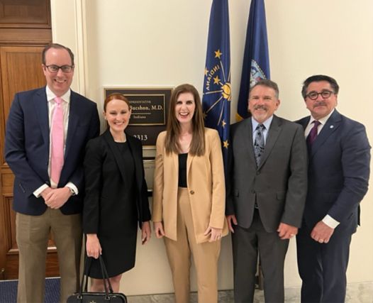 Members of the Medicaid Home-Based Care Executive Committee posing outside Representative Bucshon's office.